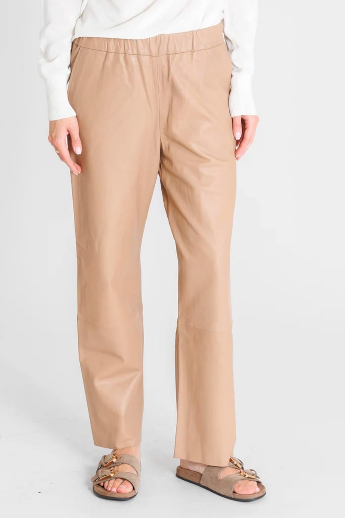 Sand-colored leather trousers with elasticated waistband - Image n°1