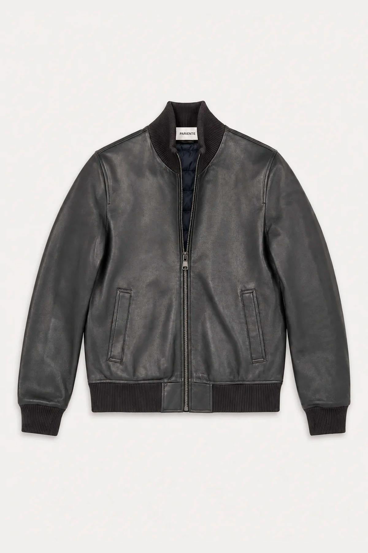 Navy blue leather varsity jacket with a quilted, down-jacket-style lining. - Image n°1