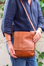 Cognac-colored oiled cowhide crossbody bag - Image n°1