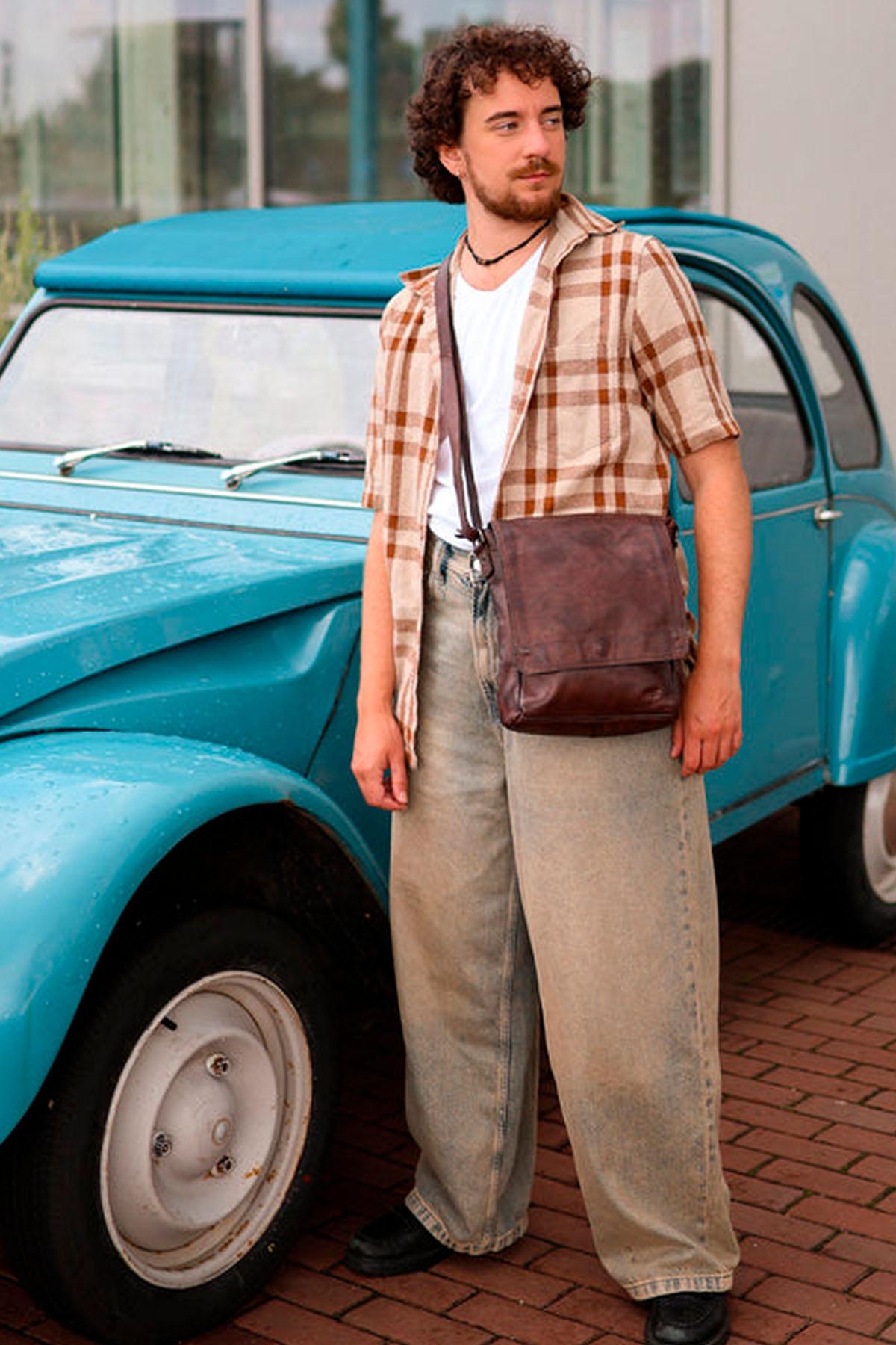Brown oiled cowhide crossbody bag - Image n°1