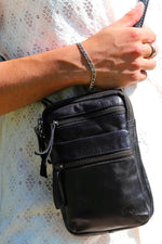 Black leather bag with embossed logo - Image n°1