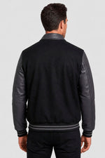 Black and grey collared varsity jacket with embroidered logo - Image n°2