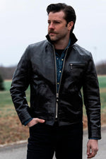 Glossy black leather jacket with a shirt collar - Image n°1