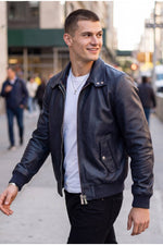 Iconic navy blue leather jacket with tartan lining - Image n°1
