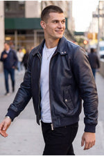 Iconic navy blue leather jacket with tartan lining - Image n°1