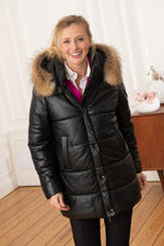 Women's black real leather and fur down jacket - Image n°1